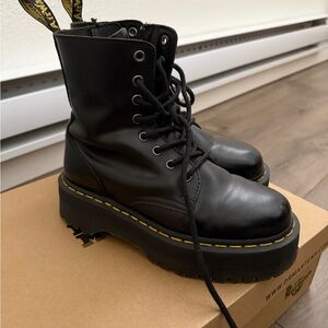 Dr. Martens Black Combat Boots with High-Top Design and Chunky Sole